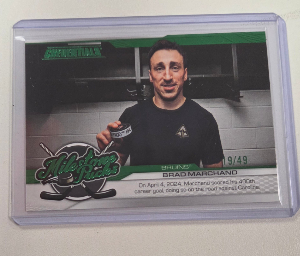Brad Marchand 19/49 milestone pucks credentials #mp-bm (cabinet)