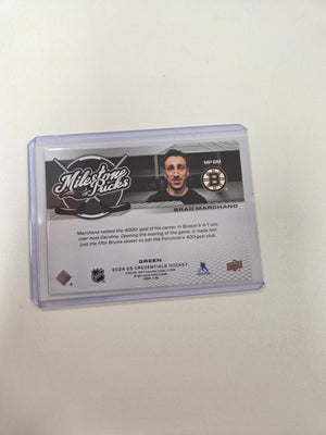 Brad Marchand 19/49 milestone pucks credentials #mp-bm (cabinet)