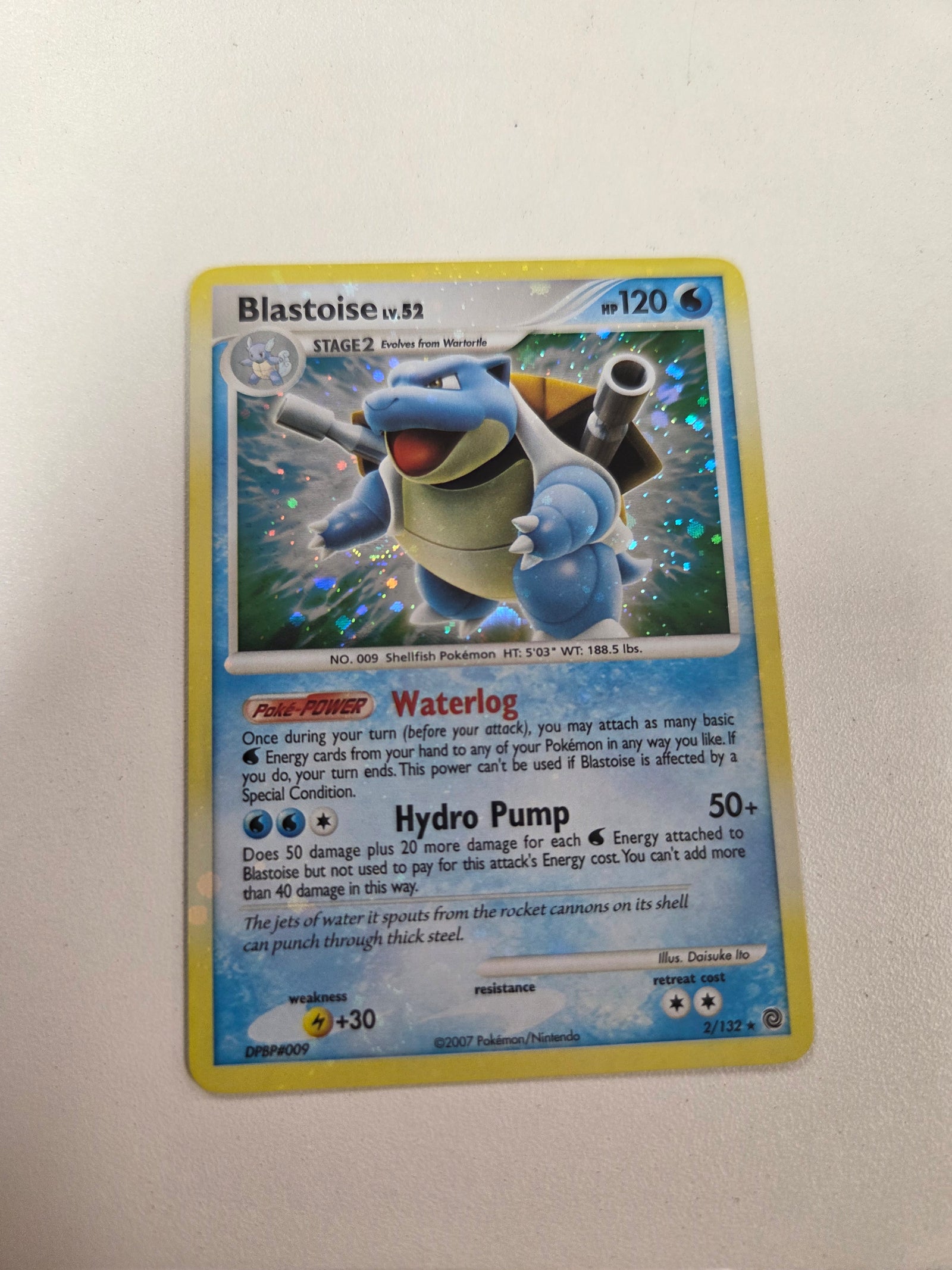 Blastoise (2)/132 Bleed Holo error with spiral on bottom left (Cabinet-LP)