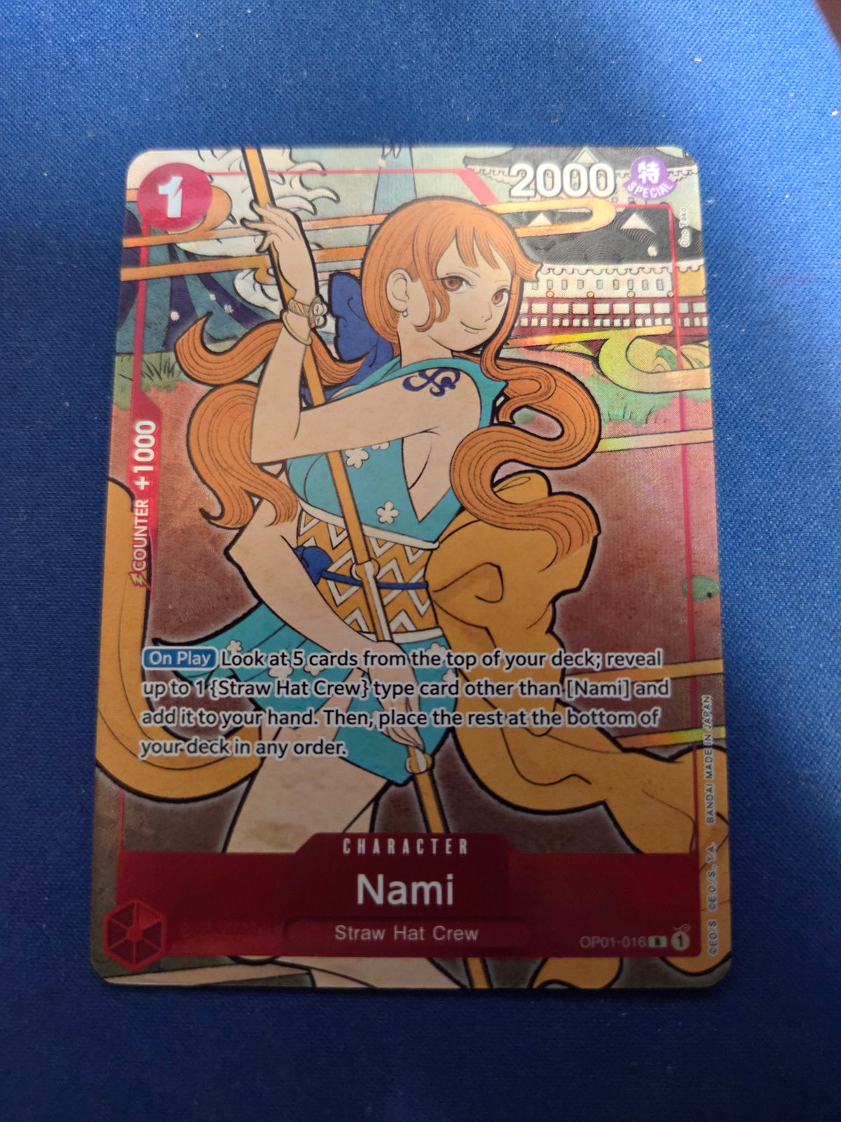 Nami (English Version 1st Anniversary Set) (OP01-016) - One Piece Promotion Cards Foil (Cabinet-NM)