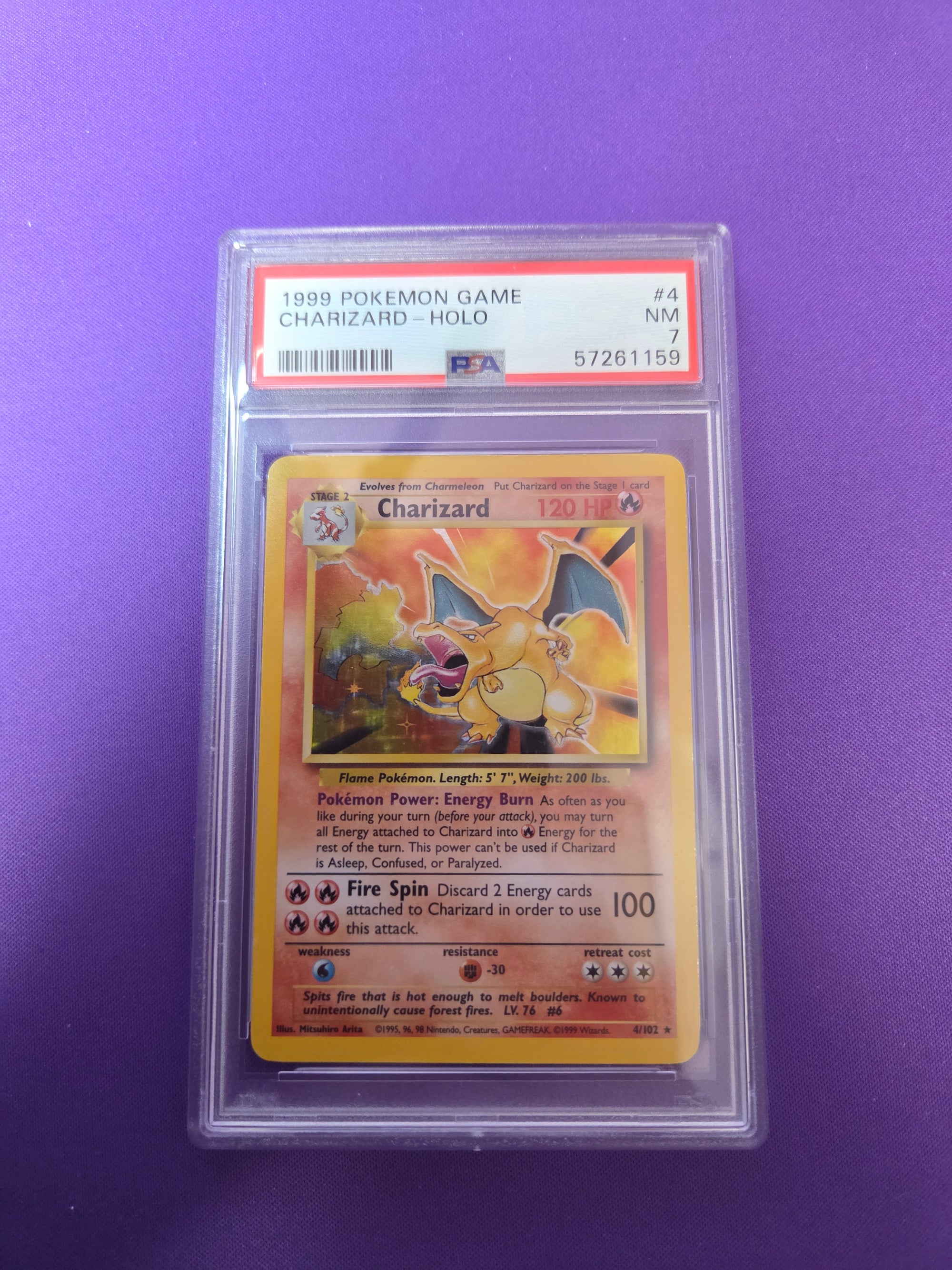 PSA 7 Charizard Base Set Unlimited #4 (Cabinet)