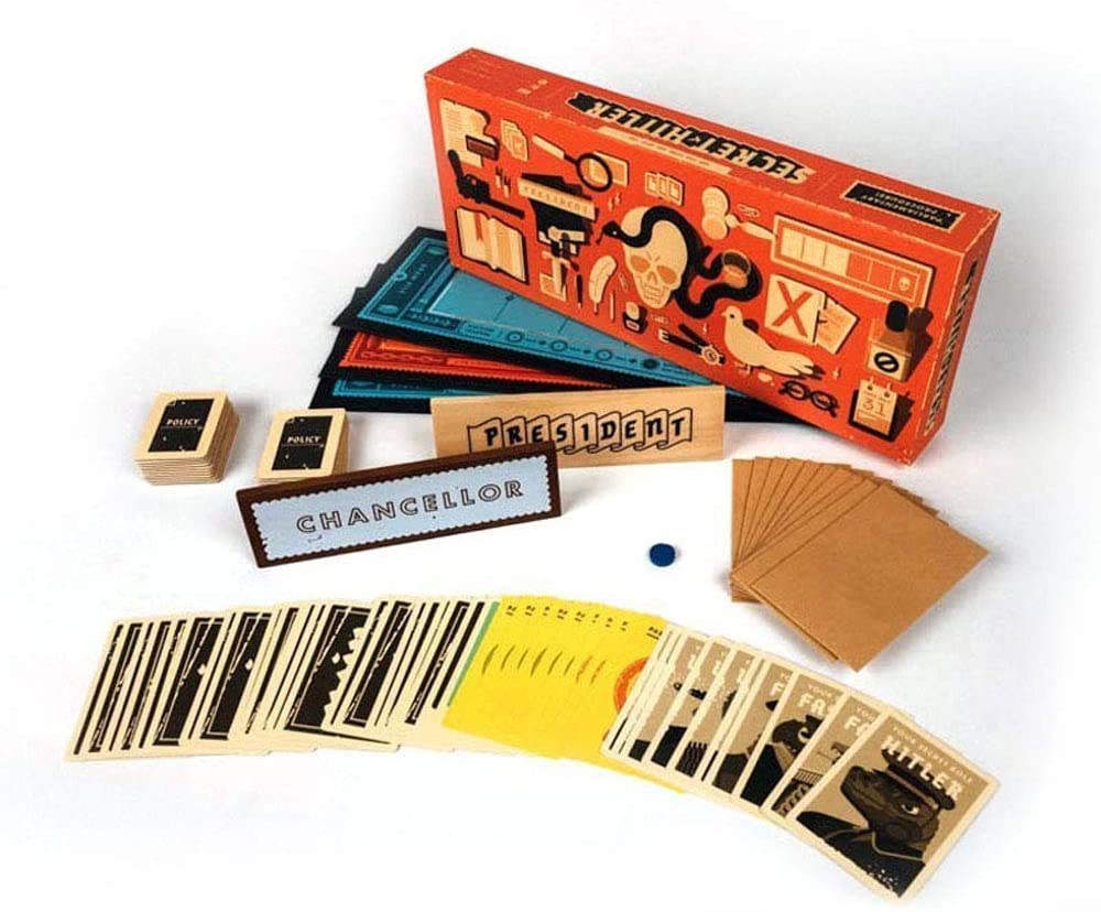 a stack of books sitting on top of a bed 